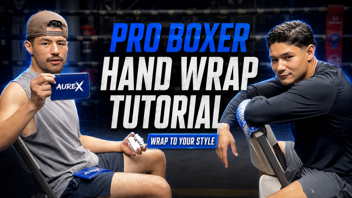 Load video: Two professional boxers demonstrate a customized hand-wrapping technique inside a boxing gym using AUREX boxing gel pads and blue-and-white hand wraps for added knuckle and wrist protection during training.